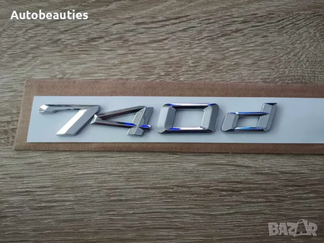сребриста емблема BMW 740d